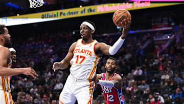 Atlanta Hawks forward Onyeka Okongwu secures a rebound against the Philadelphia 76ers