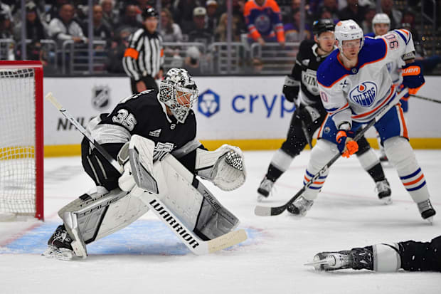 Hockey goalie stops shot attemp