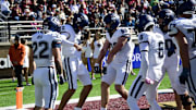 Oct 18, 2025; Chestnut Hill, Massachusetts, USA;  UConn Huskies quarterback Joe Fagnano (2) reacts with tight end Alex Honig (86) after scoring a touchdown during the first half against the Boston College Eagles at Alumni Stadium. Mandatory Credit: Bob DeChiara-Imagn Images