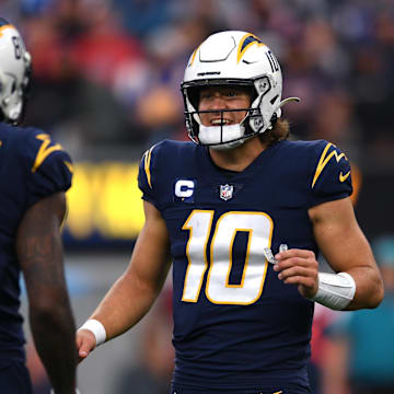Los Angeles Chargers quarterback Justin Herbert (10) talks to wide receiver Mike Williams (81) during the second half at SoFi Stadium. 