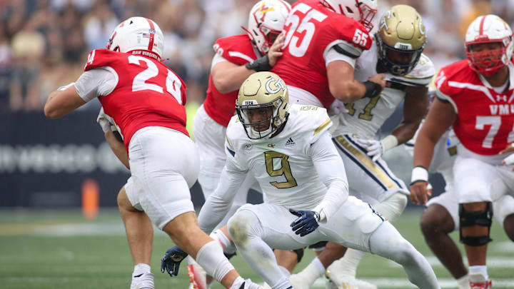 Sep 14, 2024; Atlanta, Georgia, USA; Georgia Tech Yellow Jackets defensive lineman Romello Height (9) tackles Virginia Military Institute Keydets running back Hunter Rice (24) in the second quarter at Bobby Dodd Stadium at Hyundai Field. Mandatory Credit: Brett Davis-Imagn Images
