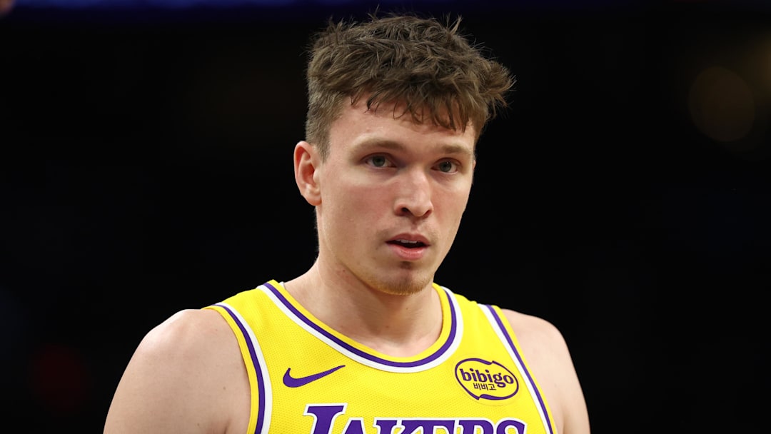 Dec 23, 2025; Phoenix, Arizona, USA; Los Angeles Lakers forward Dalton Knecht (4) against the Phoenix Suns at Mortgage Matchup Center. Mandatory Credit: Mark J. Rebilas-Imagn Images