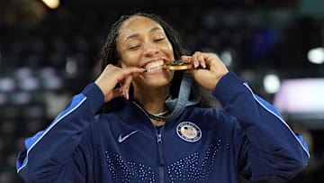 USA forward A'Ja Wilson (9) celebrates with the gold medal after defeating France at the 2024 Paris Olympics.