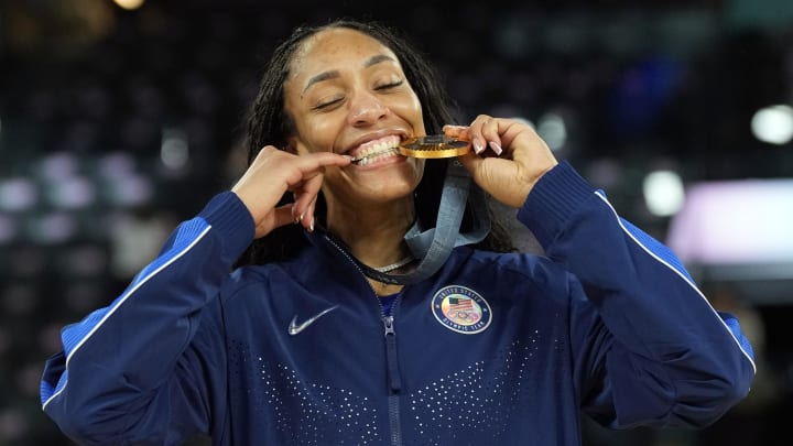 Aug 11, 2024; Paris, France; United States forward A'Ja Wilson (9) celebrates with the gold medal after defeating France in the women's gold medal game during the Paris 2024 Olympic Summer Games at Accor Arena. Mandatory Credit: Kyle Terada-USA TODAY Sports