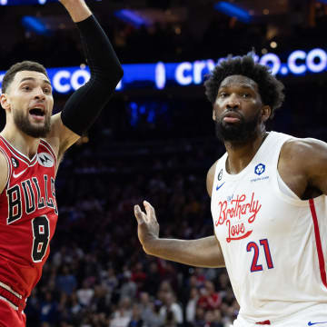 Mar 20, 2023; Philadelphia, Pennsylvania, USA; Philadelphia 76ers center Joel Embiid (21) fouls out of the game on a foul against Chicago Bulls guard Zach LaVine (8) during overtime at Wells Fargo Center. Mandatory Credit: Bill Streicher-USA TODAY Sports