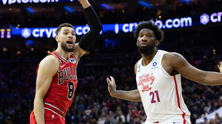Mar 20, 2023; Philadelphia, Pennsylvania, USA; Philadelphia 76ers center Joel Embiid (21) fouls out of the game on a foul against Chicago Bulls guard Zach LaVine (8) during overtime at Wells Fargo Center. Mandatory Credit: Bill Streicher-USA TODAY Sports