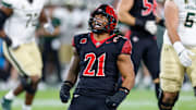 Oct 3, 2025; San Diego, California, USA; San Diego State Aztecs linebacker Tano Letuli (21) celebrates after a tackle during the first half against the Colorado State Rams at Snapdragon Stadium.