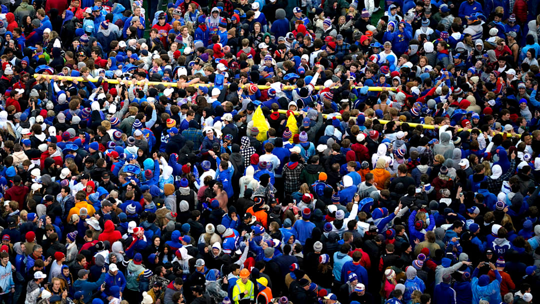 Fans celebrate a Kansas football win at David Booth Kansas Memorial Stadium