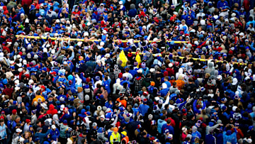 Fans celebrate a Kansas football win at David Booth Kansas Memorial Stadium