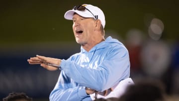 Kansas coach Lance Leipold talks with his team following Friday's Spring Preview at Rock Chalk Park.