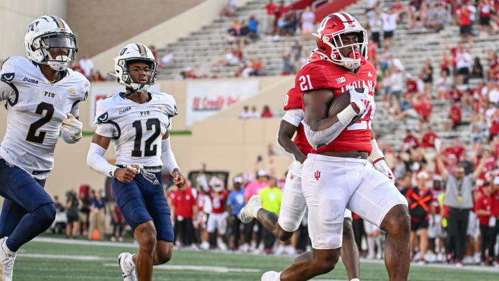 Aug 31, 2024; Bloomington, Indiana, USA;  Indiana Hoosiers running back Elijah Green (21) runs for a touchdown against the Florida International Panthers during the second half at Memorial Stadium. Mandatory Credit: Robert Goddin-USA TODAY Sports