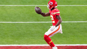 Feb 11, 2024; Paradise, Nevada, USA;  Kansas City Chiefs wide receiver Mecole Hardman Jr. (12) scores the winning touchdown against the San Francisco 49ers during overtime in Super Bowl LVIII at Allegiant Stadium. Mandatory Credit: Stephen R. Sylvanie-USA TODAY Sports