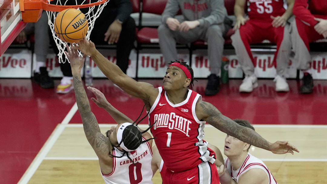Ohio State forward Amare Bynum (1) blocks a shot by Wisconsin guard Braeden Carrington (0) during the first half of their game Saturday, January 31, 2026 at the Kohl Center in Madison, Wisconsin.