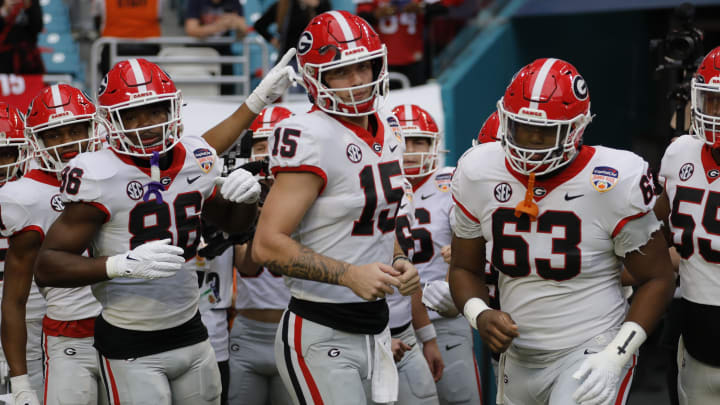 Dec 30, 2023; Miami Gardens, FL, USA; Georgia Bulldogs quarterback Carson Beck (15) leads the team onto the field before the game against the Florida State Seminoles for the 2023 Orange Bowl at Hard Rock Stadium. Mandatory Credit: Sam Navarro-USA TODAY Sports