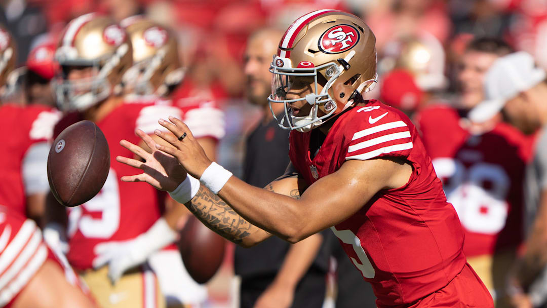 Aug 19, 2023; Santa Clara, California, USA;  San Francisco 49ers quarterback Trey Lance (5) warms up before the start of the first quarter against the Denver Broncos at Levi's Stadium. Mandatory Credit: Stan Szeto-Imagn Images