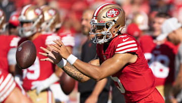 Aug 19, 2023; Santa Clara, California, USA;  San Francisco 49ers quarterback Trey Lance (5) warms up before the start of the first quarter against the Denver Broncos at Levi's Stadium. Mandatory Credit: Stan Szeto-Imagn Images