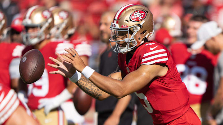 Aug 19, 2023; Santa Clara, California, USA;  San Francisco 49ers quarterback Trey Lance (5) warms up before the start of the first quarter against the Denver Broncos at Levi's Stadium. Mandatory Credit: Stan Szeto-Imagn Images