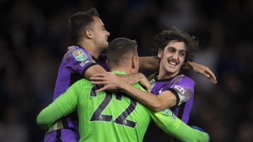 Wolverhampton Wanderers v Tottenham Hotspur - Carabao Cup Third Round - Gil and Reguilon celebrate in the 2021 Carabao Cup win at Wolves 