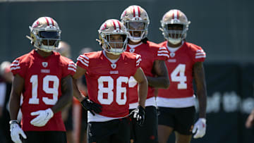 Jun 10, 2025; Santa Clara, CA, USA; San Francisco 49ers wide receivers Jacob Cowing (19), Junior Bergen (86), Malik Knowles (3) and Isaiah Neyor (14) queue up for a passing drill during an OTA at Levi's Stadium. Mandatory Credit: D. Ross Cameron-Imagn Images