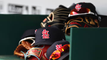 Apr 24, 2022; Cincinnati, Ohio, USA; A view of St. Louis Cardinals players    hats and gloves in the dugout during a game with the Cincinnati Reds at Great American Ball Park. Mandatory Credit: David Kohl-Imagn Images