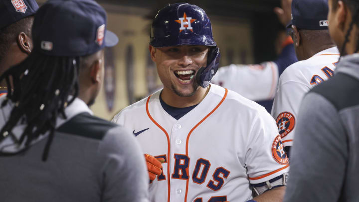 Sep 15, 2022; Houston, Texas, USA; Houston Astros second baseman Aledmys Diaz (16) celebrates in the dugout after hitting a home run during the seventh inning against the Oakland Athletics at Minute Maid Park