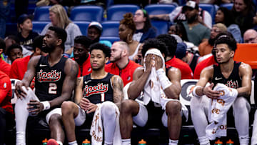 Mar 16, 2024; New Orleans, Louisiana, USA;  Portland Trail Blazers guard Anfernee Simons (1) and center Deandre Ayton (2) on the bench in the final few minutes of the game against the New Orleans Pelicans during the second half at Smoothie King Center. Mandatory Credit: Stephen Lew-Imagn Images