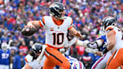 Jan 12, 2025; Orchard Park, New York, USA; Denver Broncos quarterback Bo Nix (10) throws downfield during the second quarter against the Buffalo Bills in an AFC wild card game at Highmark Stadium. Mandatory Credit: Mark Konezny-Imagn Images
