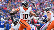 Jan 12, 2025; Orchard Park, New York, USA; Denver Broncos quarterback Bo Nix (10) throws downfield during the second quarter against the Buffalo Bills in an AFC wild card game at Highmark Stadium. Mandatory Credit: Mark Konezny-Imagn Images