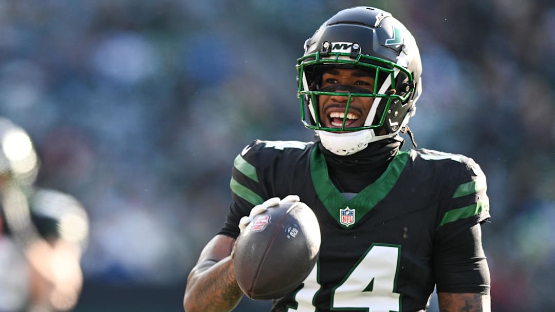 Dec 1, 2024; East Rutherford, New Jersey, USA; New York Jets wide receiver Malachi Corley (14) celebrates after a play during the first quarter against the Seattle Seahawks at MetLife Stadium. Mandatory Credit: Mark Smith-Imagn Images