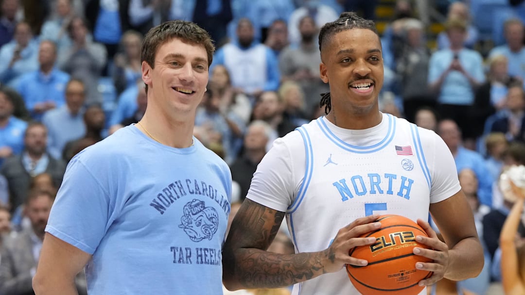 Jan 21, 2023; Chapel Hill, North Carolina, USA; Former North Carolina Tar Heels great Tyler Hansbrough presents forward Armando Bacot (5) with the game ball after the game. Bacot became the all-time Tar Heels rebounding leader during the game breaking Hansbrough s record. Mandatory Credit: Bob Donnan-Imagn Images Jan 21, 2023; Chapel Hill, North Carolina, USA; Former North Carolina Tar Heels great Tyler Hansbrough presents forward Armando Bacot (5) with the game ball after the game. Bacot became the all-time Tar Heels rebounding leader during the game breaking Hansbrough s record. Mandatory Credit: Bob Donnan-Imagn Images