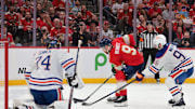 Jun 17, 2025; Sunrise, Florida, USA; Florida Panthers center Sam Bennett (9) controls the puck defended by Edmonton Oilers defenseman Jake Walman (96) during the second period in game six of the 2025 Stanley Cup Final at Amerant Bank Arena. 