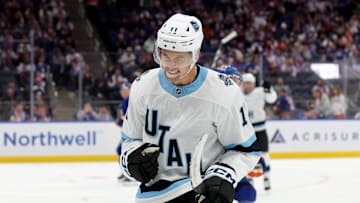 Oct 10, 2024; Elmont, New York, USA; Utah Hockey Club right wing Dylan Guenther (11) celebrates his goal against the New York Islanders during the third period at UBS Arena. Mandatory Credit: Brad Penner-Imagn Images