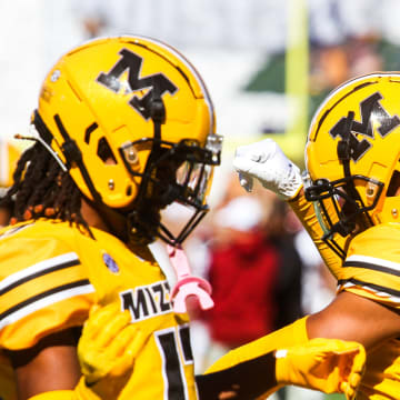 Missouri wide receiver Daniel Blood, middle, dances with Marquis Johnson, left, and Luther Burden, right, during a college football game against South Carolina at Memorial Stadium on Oct. 21, 2023, in Columbia, Mo.