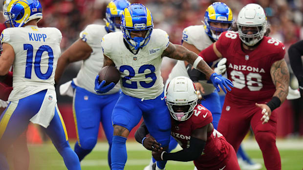 Arizona Cardinals cornerback Starling Thomas V (24) tackles Los Angeles Rams running back Kyren Williams (23) at State Farm S