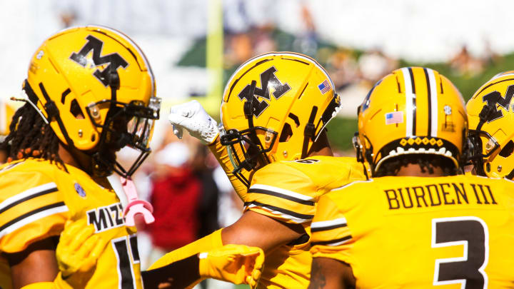 Missouri wide receiver Daniel Blood, middle, dances with Marquis Johnson, left, and Luther Burden, right, during a college football game against South Carolina at Memorial Stadium on Oct. 21, 2023, in Columbia, Mo.