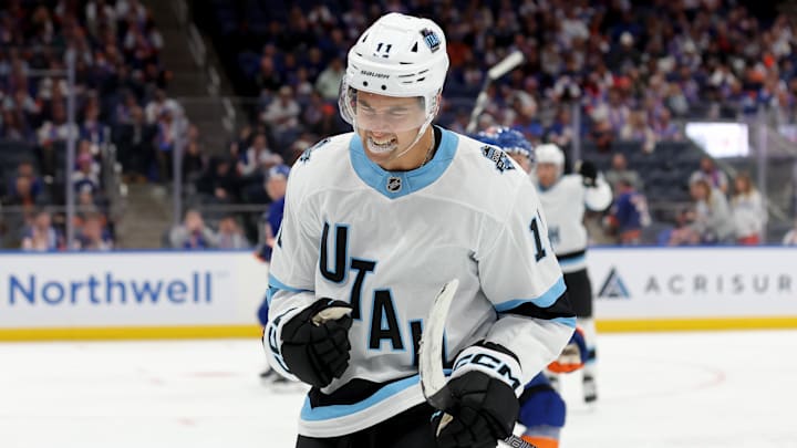 Oct 10, 2024; Elmont, New York, USA; Utah Hockey Club right wing Dylan Guenther (11) celebrates his goal against the New York Islanders during the third period at UBS Arena. Mandatory Credit: Brad Penner-Imagn Images