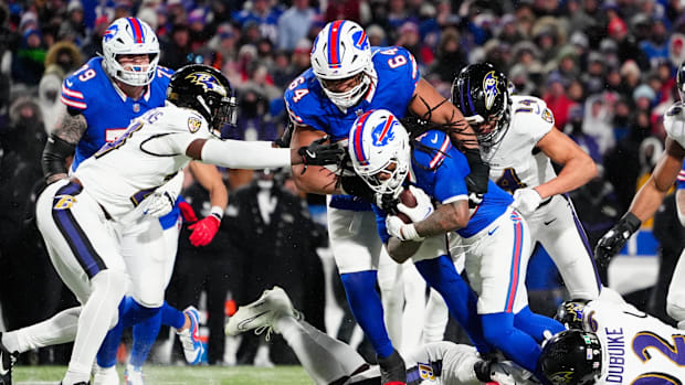 Jan 19, 2025; Orchard Park, New York, USA; Buffalo Bills running back James Cook (4) runs the ball during the fourth quarter 