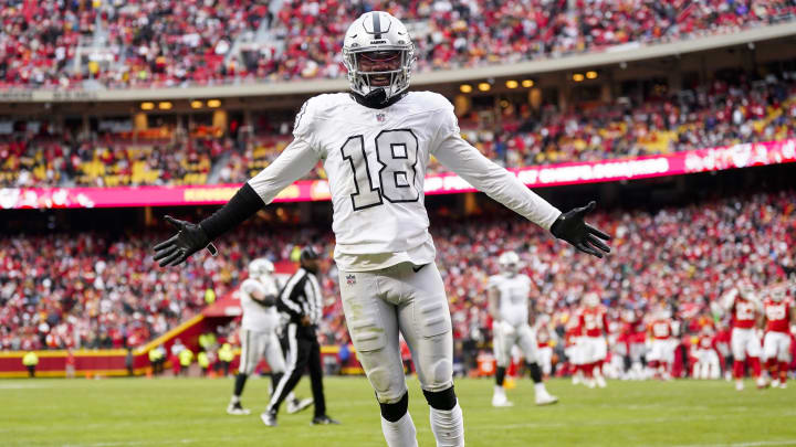 Dec 25, 2023; Kansas City, Missouri, USA; Las Vegas Raiders cornerback Jack Jones (18) interacts with then crowd during the second half against the Kansas City Chiefs at GEHA Field at Arrowhead Stadium. Mandatory Credit: Jay Biggerstaff-USA TODAY Sports