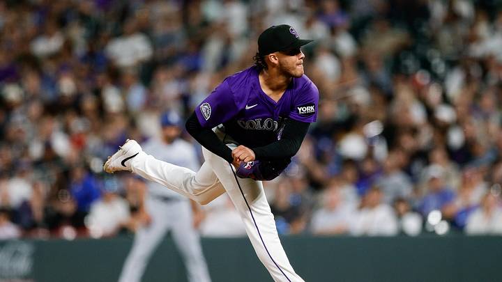 Aug 18, 2025; Denver, Colorado, USA; Colorado Rockies relief pitcher Luis Peralta (41) pitches in the seventh inning against the Los Angeles Dodgers at Coors Field. Mandatory Credit: Isaiah J. Downing-Imagn Images