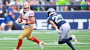 Sep 7, 2025; Seattle, Washington, USA; San Francisco 49ers running back Christian McCaffrey (23) runs the ball after a catch during the second half against the Seattle Seahawks at Lumen Field. Mandatory Credit: Steven Bisig-Imagn Images