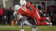 Oct 25, 2025; Cincinnati, Ohio, USA;  Baylor Bears tight end Michael Trigg (1) is unable to hold on to a catch as he is tackled by Cincinnati Bearcats linebacker Jake Golday (11) and defensive back Tre Gola-Callard (6) in the second half at Nippert Stadium. Mandatory Credit: Aaron Doster-Imagn Images