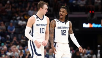 Apr 4, 2023; Memphis, Tennessee, USA; Memphis Grizzlies guard Luke Kennard (10) and Memphis Grizzlies guard Ja Morant (12) talk during the second half against the Portland Trail Blazers at FedExForum. Mandatory Credit: Petre Thomas-USA TODAY Sports
