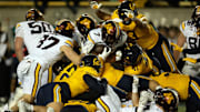 Sep 13, 2025; Berkeley, California, USA; Minnesota Golden Gophers running back Fame Ijeboi (7) is stopped short of the goal line by the California Golden Bears defense during the second quarter at California Memorial Stadium. Mandatory Credit: D. Ross Cameron-Imagn Images