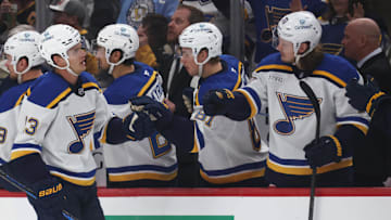 Mar 13, 2025; Pittsburgh, Pennsylvania, USA; St. Louis Blues right wing Alexey Toropchenko (13) celebrates his goal with the Blues bench against the Pittsburgh Penguins during the third period at PPG Paints Arena. Mandatory Credit: Charles LeClaire-Imagn Images