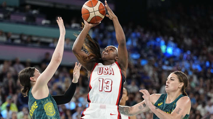 Aug 9, 2024; Paris, France; United States guard Jackie Young (13) shoots against Australia forward Cayla George (15) in a women's basketball semifinal game during the Paris 2024 Olympic Summer Games at Accor Arena. Mandatory Credit: Sarah Phipps-USA TODAY Sports