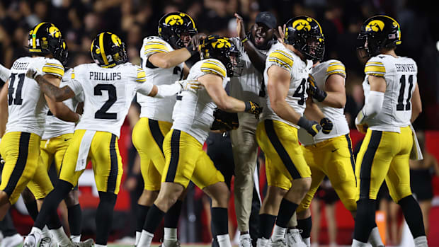 Iowa Hawkeyes defense celebrates a big play against Rutger