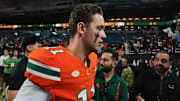 Nov 15, 2025; Miami Gardens, Florida, USA; Miami Hurricanes quarterback Carson Beck (11) walks off the field after the game against NC State Wolfpack at Hard Rock Stadium. Mandatory Credit: Sam Navarro-Imagn Images