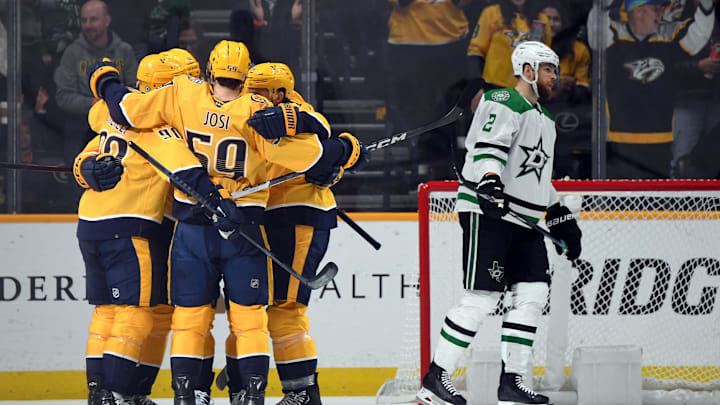 Dec 23, 2023; Nashville, Tennessee, USA; Nashville Predators players celebrate after a goal by Nashville Predators center Colton Sissons (10) during the second period against the Dallas Stars at Bridgestone Arena. Mandatory Credit: Christopher Hanewinckel-USA TODAY Sports