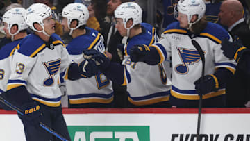 Mar 13, 2025; Pittsburgh, Pennsylvania, USA; St. Louis Blues right wing Alexey Toropchenko (13) celebrates his goal with the Blues bench against the Pittsburgh Penguins during the third period at PPG Paints Arena. Mandatory Credit: Charles LeClaire-Imagn Images