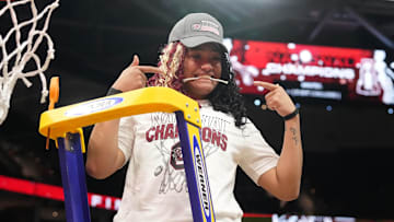 Apr 7, 2024; Cleveland, OH, USA; South Carolina Gamecocks guard Te-Hina Paopao (0) cuts down the net after defeating the Iowa Hawkeyes in the finals of the Final Four of the womens 2024 NCAA Tournament at Rocket Mortgage FieldHouse. Mandatory Credit: Kirby Lee-Imagn Images